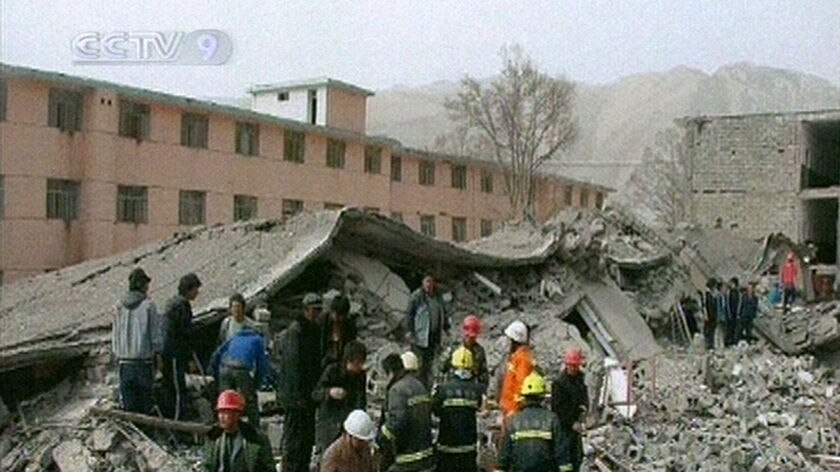 Rescue workers search for quake survivors