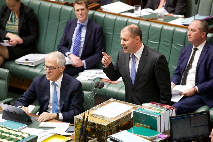 Josh Frydenberg points a finger while speaking in parliament