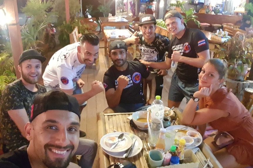 Zohab's friends have a no-phones-at-the-table rule when eating out, but here they make an exception for a group selfie.