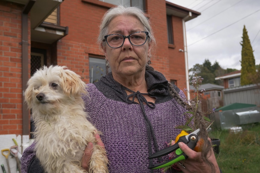 woman holding dog 