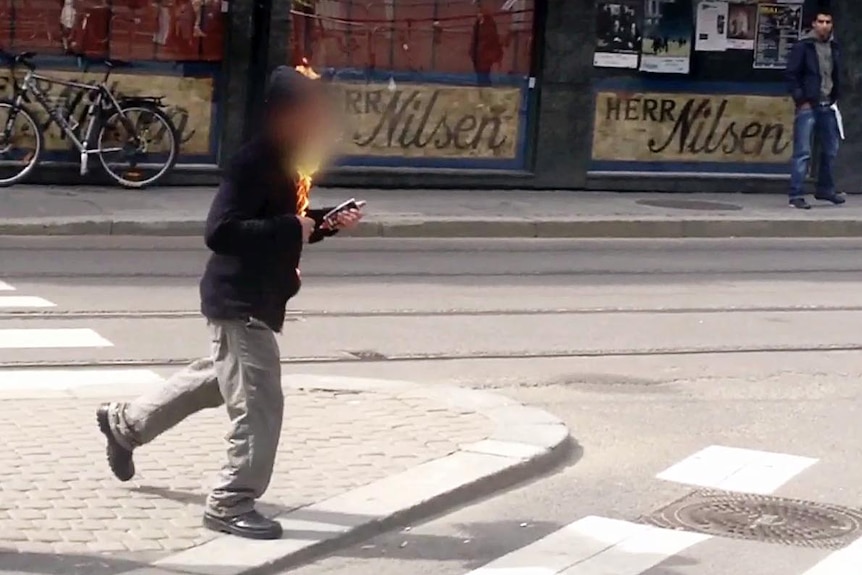 A man sets himself on fire on outside the Oslo courthouse where Anders Behring Breivik is on trial.