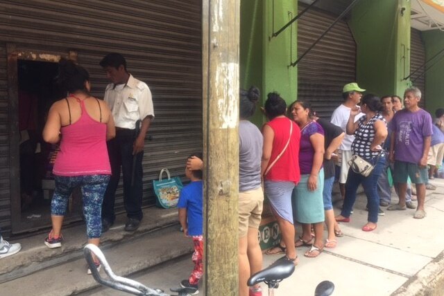 People in Juchitan queue for groceries after the earthquake.
