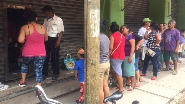 People in Juchitan queue for groceries after the earthquake.