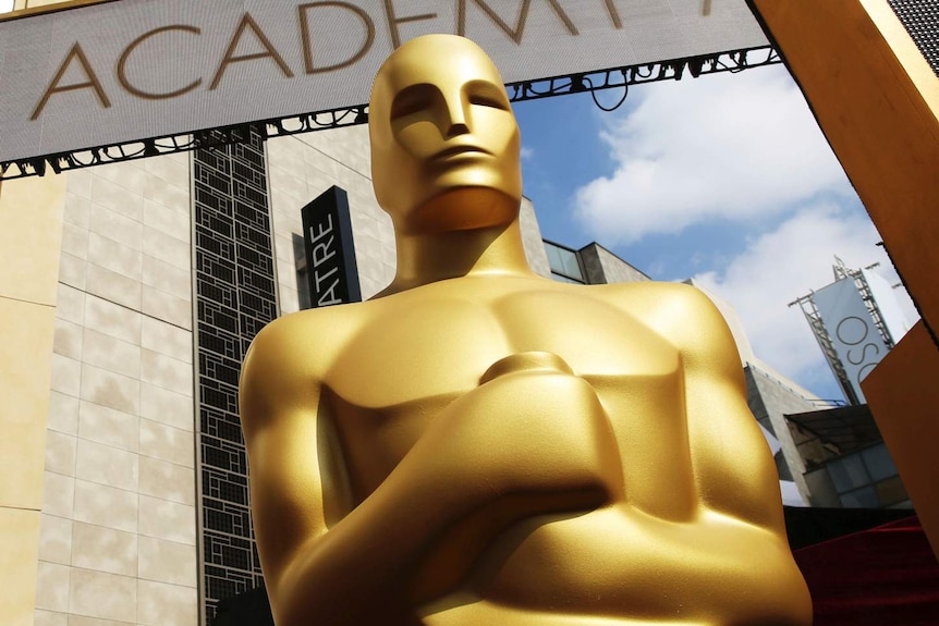 An Oscar statue appears outside the Dolby Theatre for the Academy Awards in Los Angeles.