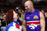 LtoR Prime Minister Julia Gillard celebrates with Western Bulldogs full forward Barry Hall