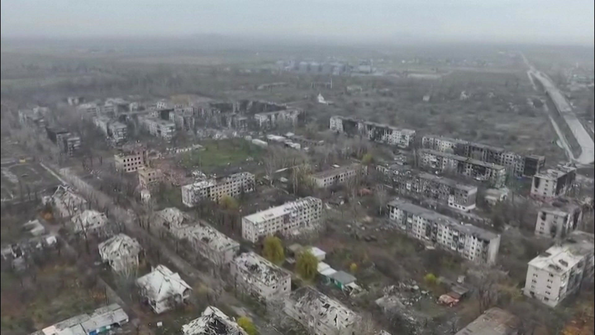 Aerial vision of Ukrainian city Pokrovsk shows destruction and damage to buildings with a foggy skyline.