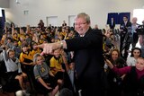 Former prime minister Kevin Rudd ignored the media but was happy to answer questions from Coorparoo State School students.