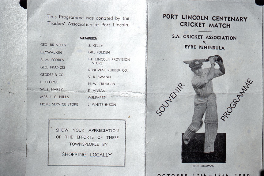 A brochure for a cricket match featuring an image of Don Bradman.