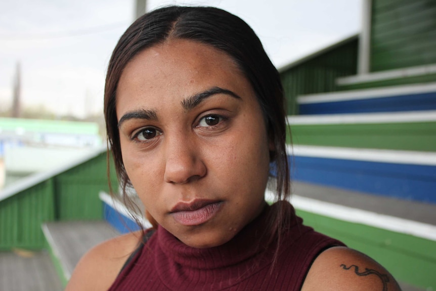 Tane Chatfield's sister, Marisha Chatfield, sits in the stands at the Armidale Rams home ground, where Tane used to play.