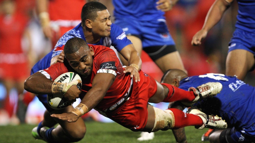 Samsoni Langi scores a try for Tonga in their Test match with Samoa in Penrith.
