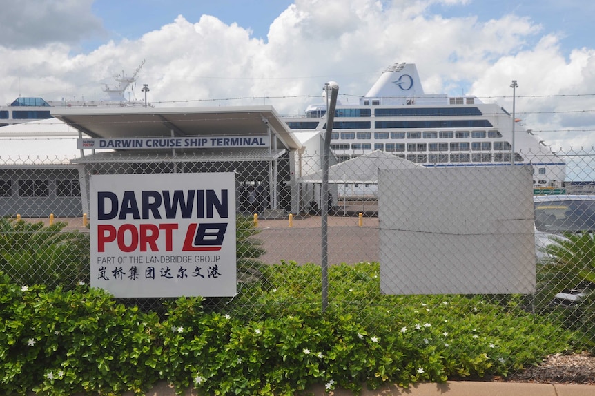 A sign on the fence of the cruise ship terminal.