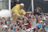 Pope Francis arrives to celebrate a mass at a park in Manila