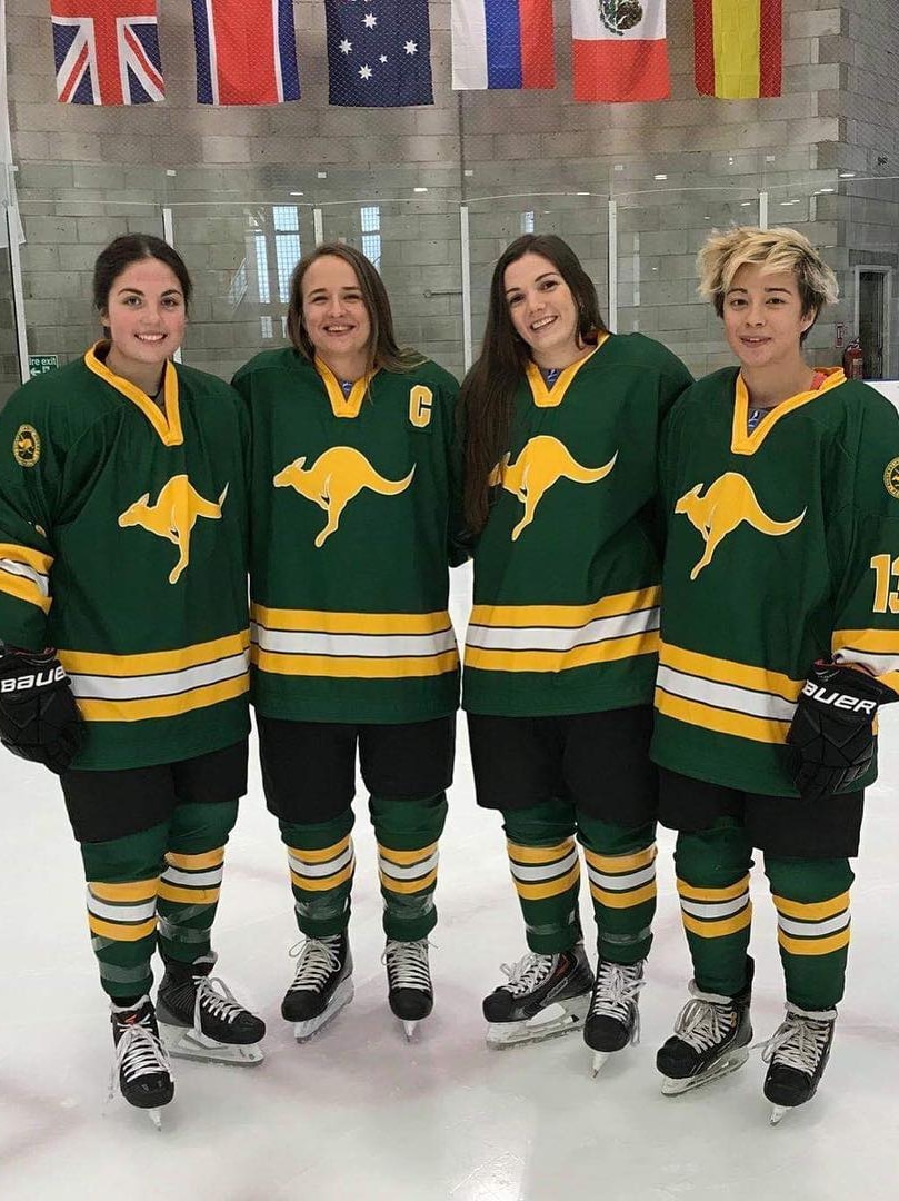 Marnie Pullin, Georgia Moore Ashlie Aparicio and Kristelle Vanderwolf stand arm in arm wearing their Australian jerseys.