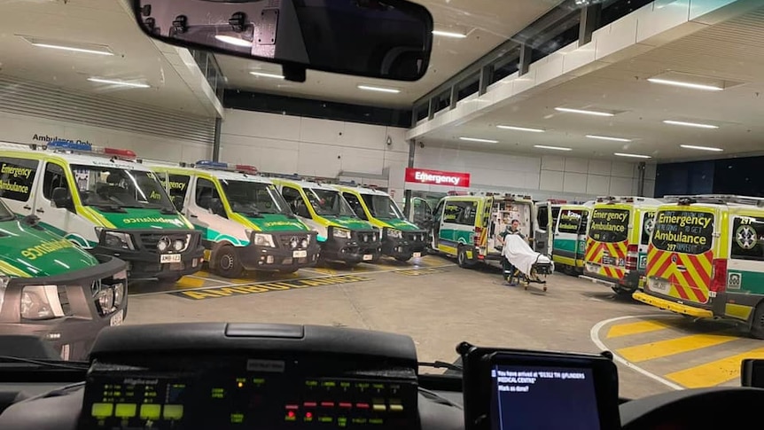 Ambulances parked inside a building.