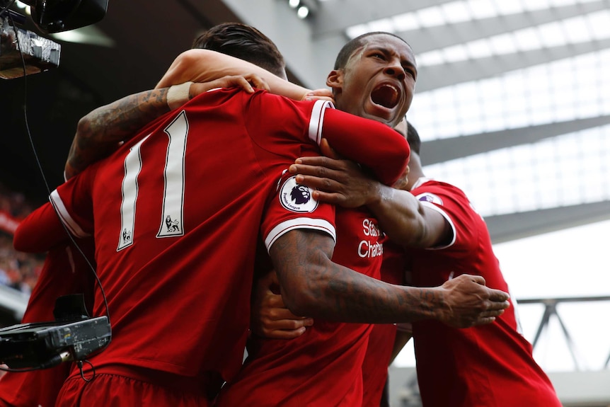 Georginio Wijnaldum celebrates a goal for Liverpool.