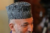 President Hamid Karzai turned up to vote before dawn.