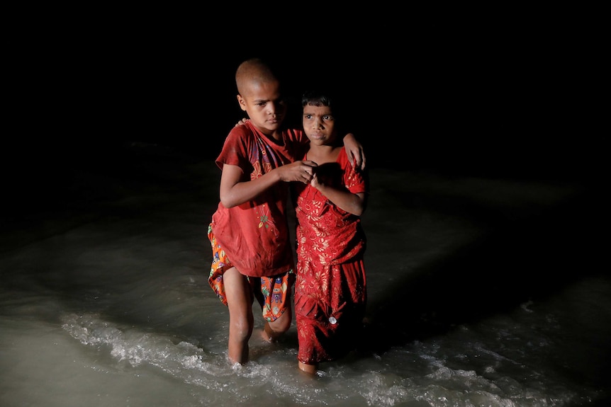 Rohingya refugee sisters, who just arrived under the cover of darkness.