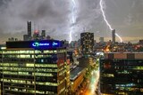 Lightning strikes over buildings in Brisbane's night sky during storm on February 11, 2018.