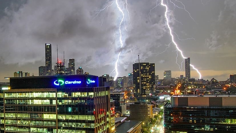 Lightning strikes over buildings in Brisbane's night sky during storm on February 11, 2018.