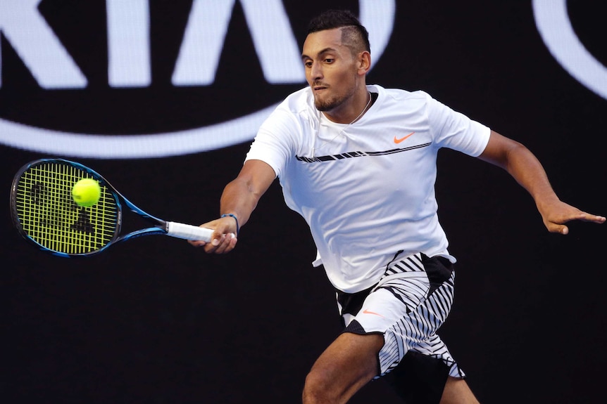 Nick Kyrgios hits a forehand against Andreas Seppi