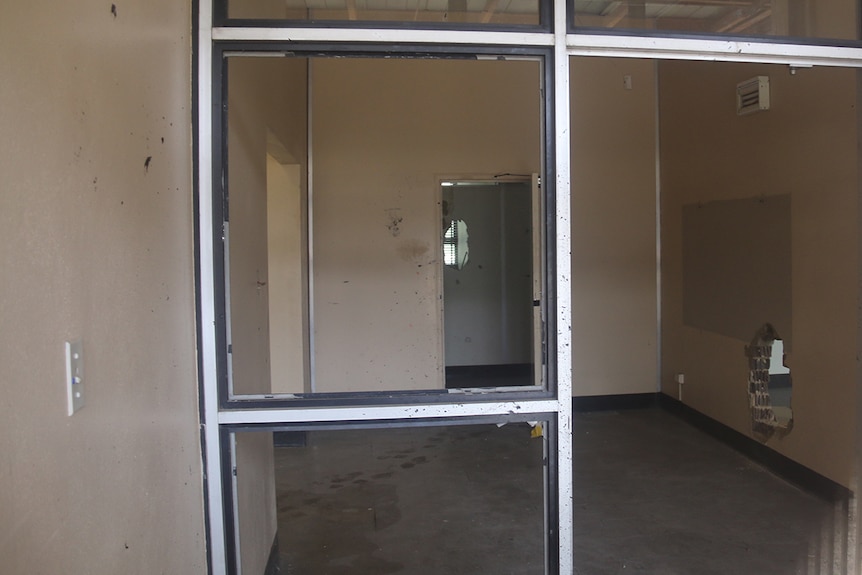 Inside Anzac Park East the building is rundown and hole is smashed through a brick wall.