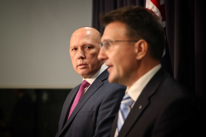 Peter Dutton and Reece Kershaw holding a press conference at Parliament House