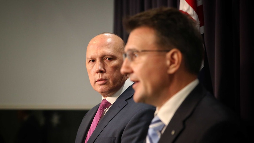 Peter Dutton and Reece Kershaw holding a press conference at Parliament House