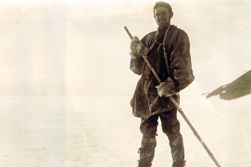 old black and white photo of man on skis 