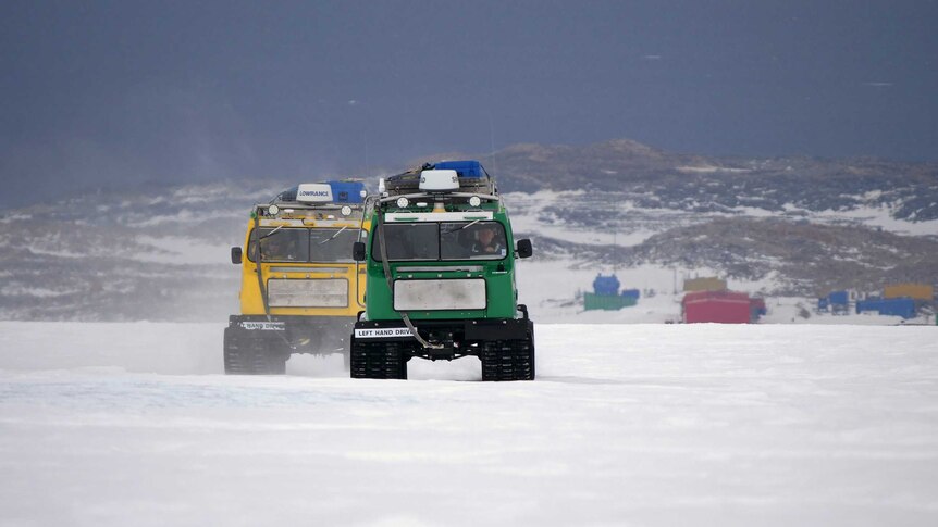 Trucks drive on the snow.