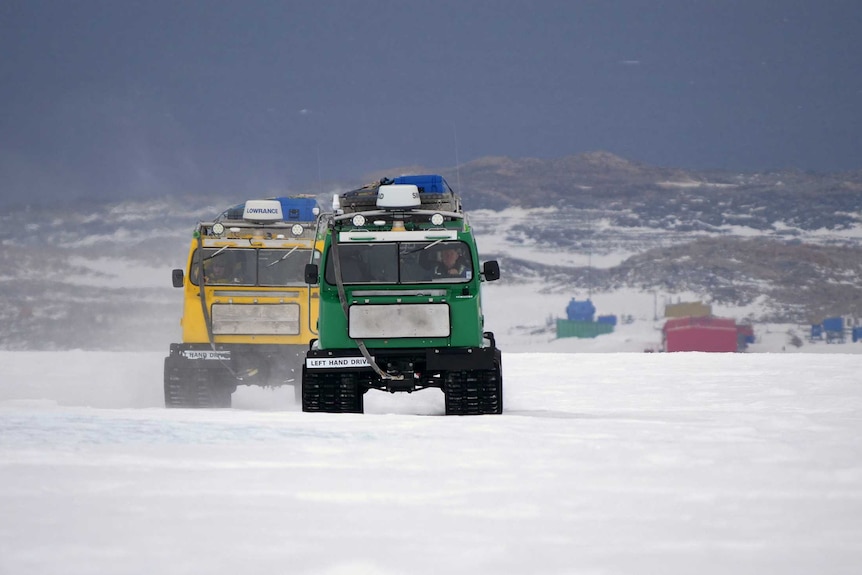 Trucks drive on the snow.