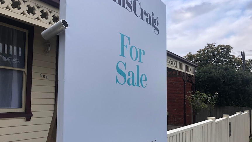  A 'for sale' sign outside a house