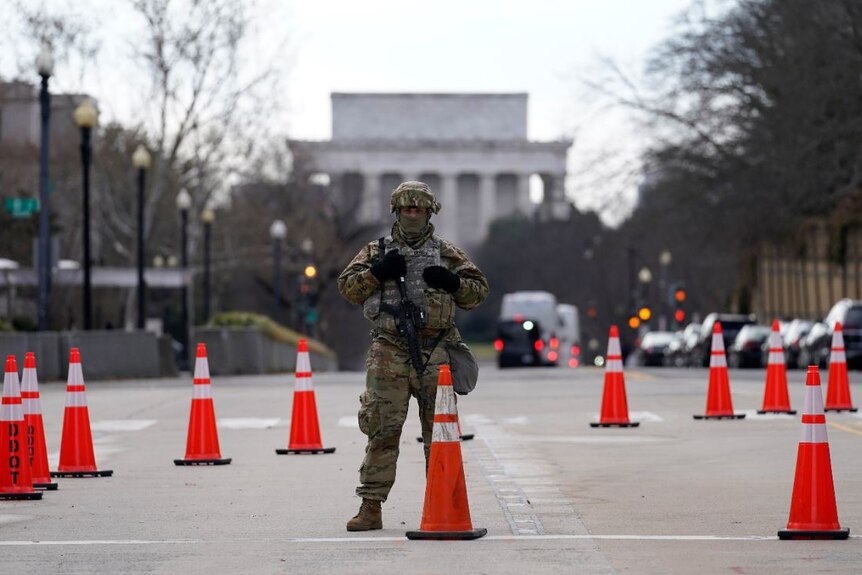 A National Guard stands at a road block near the Supreme Court