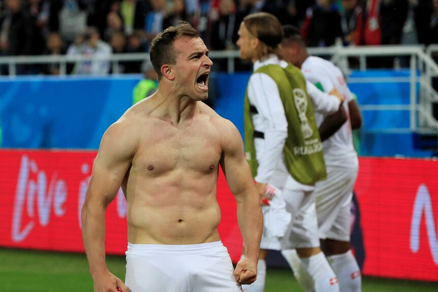 A shirtless Xherdan Shaqiri celebrates scoring winner