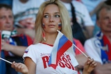 Russian fan cheers from the stands