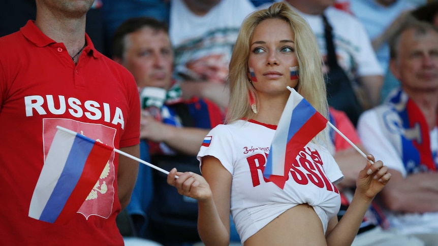 Russian fan cheers from the stands
