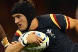 Wales' Matthew Morgan bursts through Fiji defence