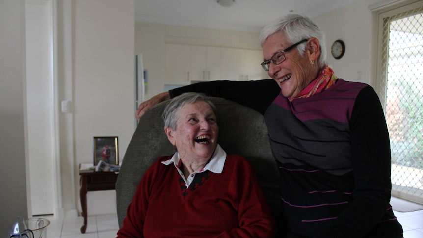 Pat and Claudia laugh together at Pat's home in Mount Martha, Victoria