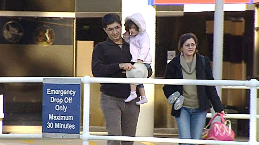 Flu worries: Parents with their daughter at a Perth hospital