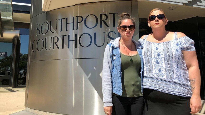 Victim Kume Harris' sister Grace stands with family friend Sarah Mackay outside Southport Courthouse on the Gold Coast.