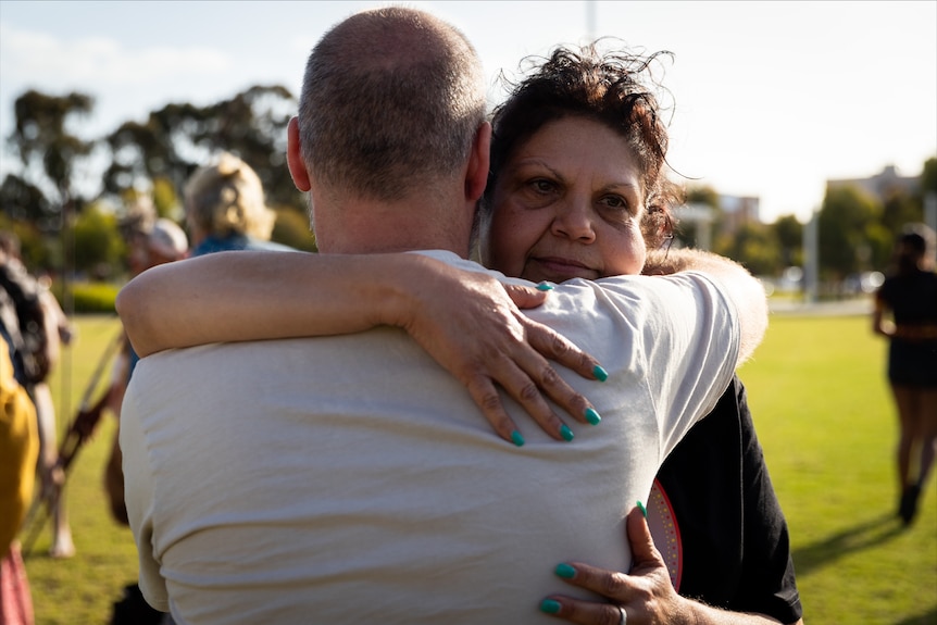 Mechelle Turvey receives a hug