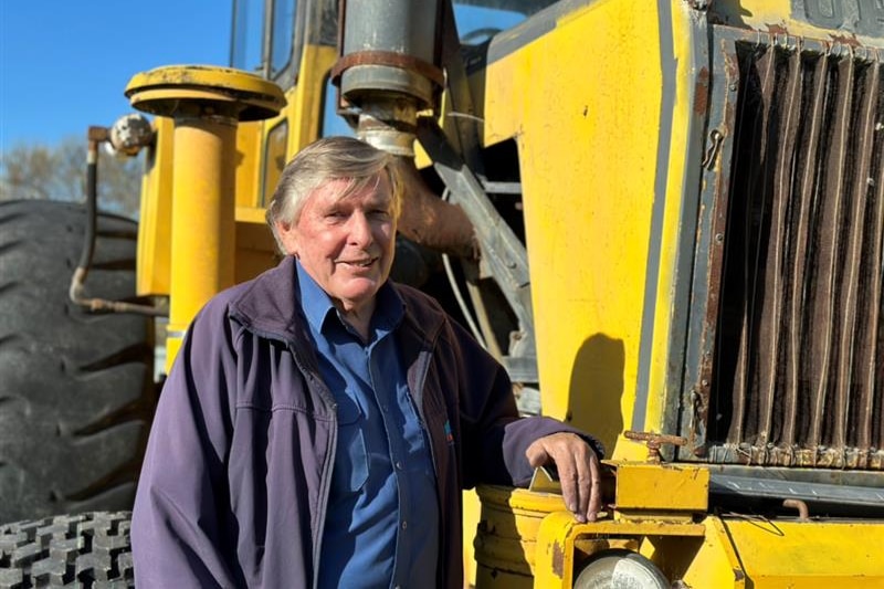 Image of a man with a tractor.