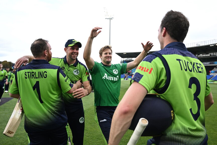 Ireland players celebrate and smile at each other