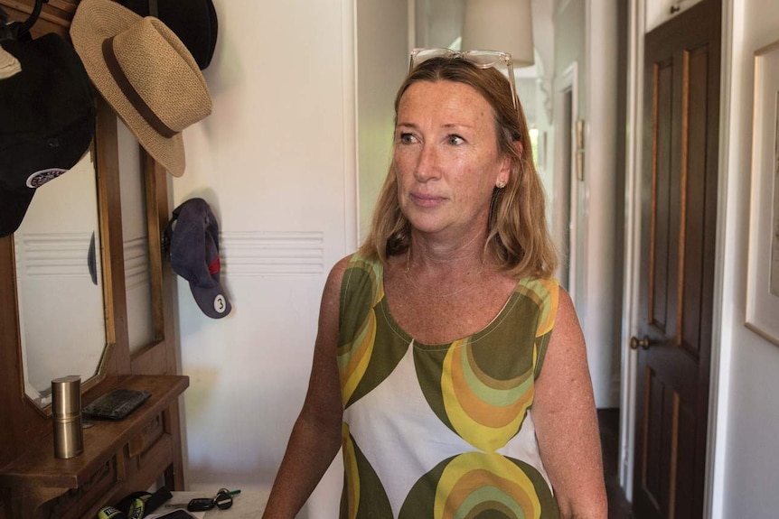 middle-aged woman in hallway