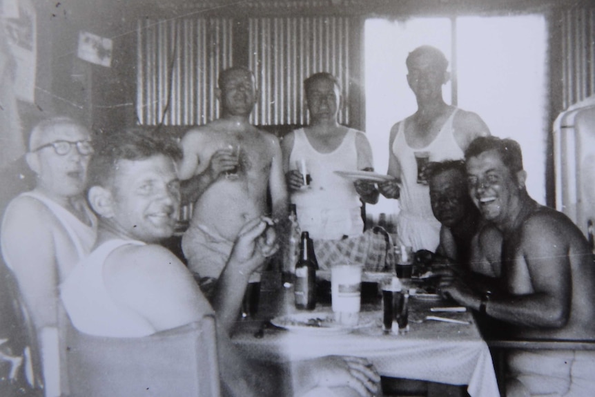 Popowski men and friends inside the shack in the 1960s. The photo is black and white
