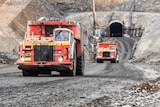 Mining trucks at the entrance to an underground mine.