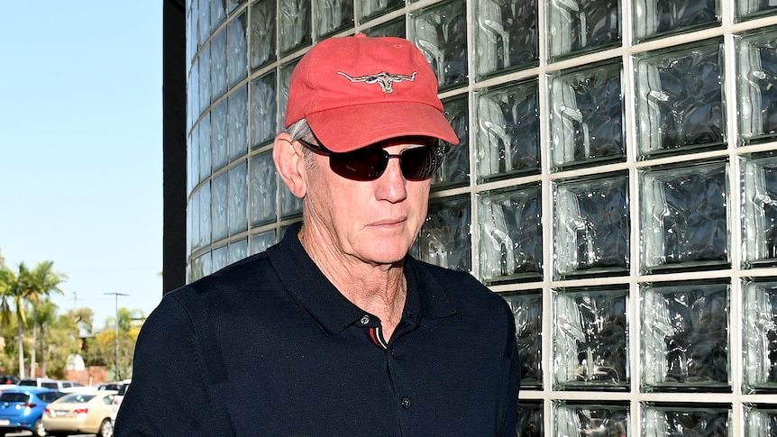 Headshot of a a man with an R M Williams hats on walking 