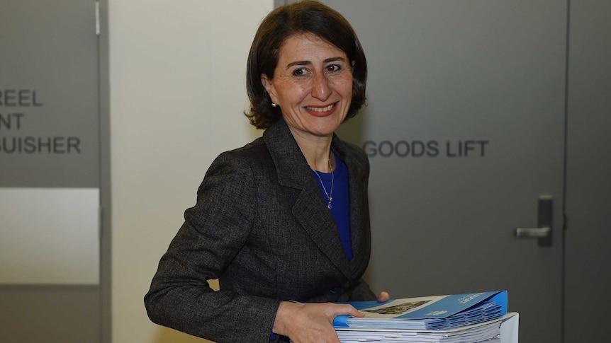 NSW Treasurer Gladys Berejiklian with budget papers.