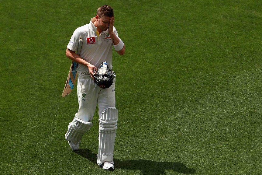 Gone early... Michael Clarke walks off after being dismissed for 74.