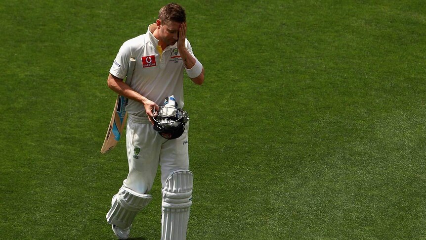 Gone early... Michael Clarke walks off after being dismissed for 74.