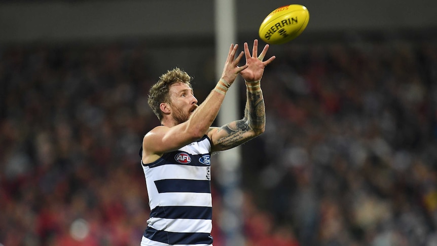 Zach Tuohy takes a mark for Geelong